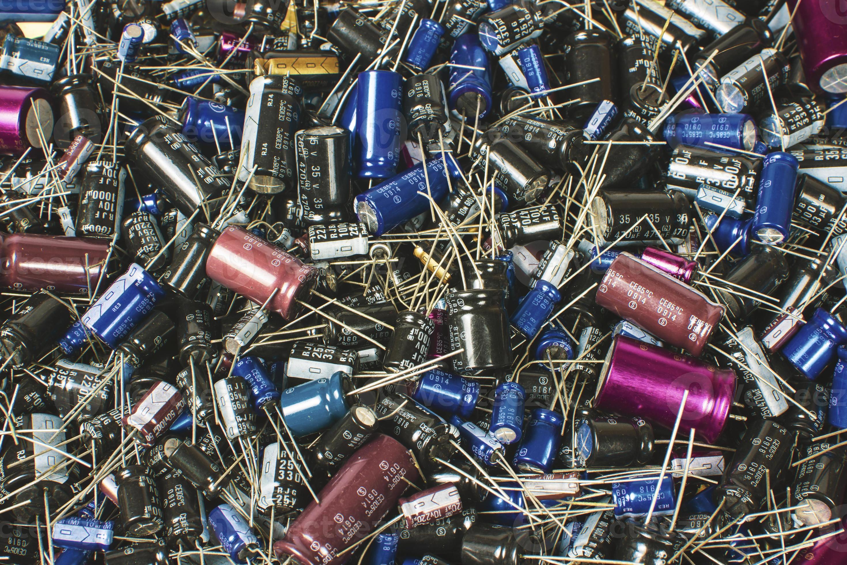 Close up of electrolyte or electrolytic capacitors heap with various