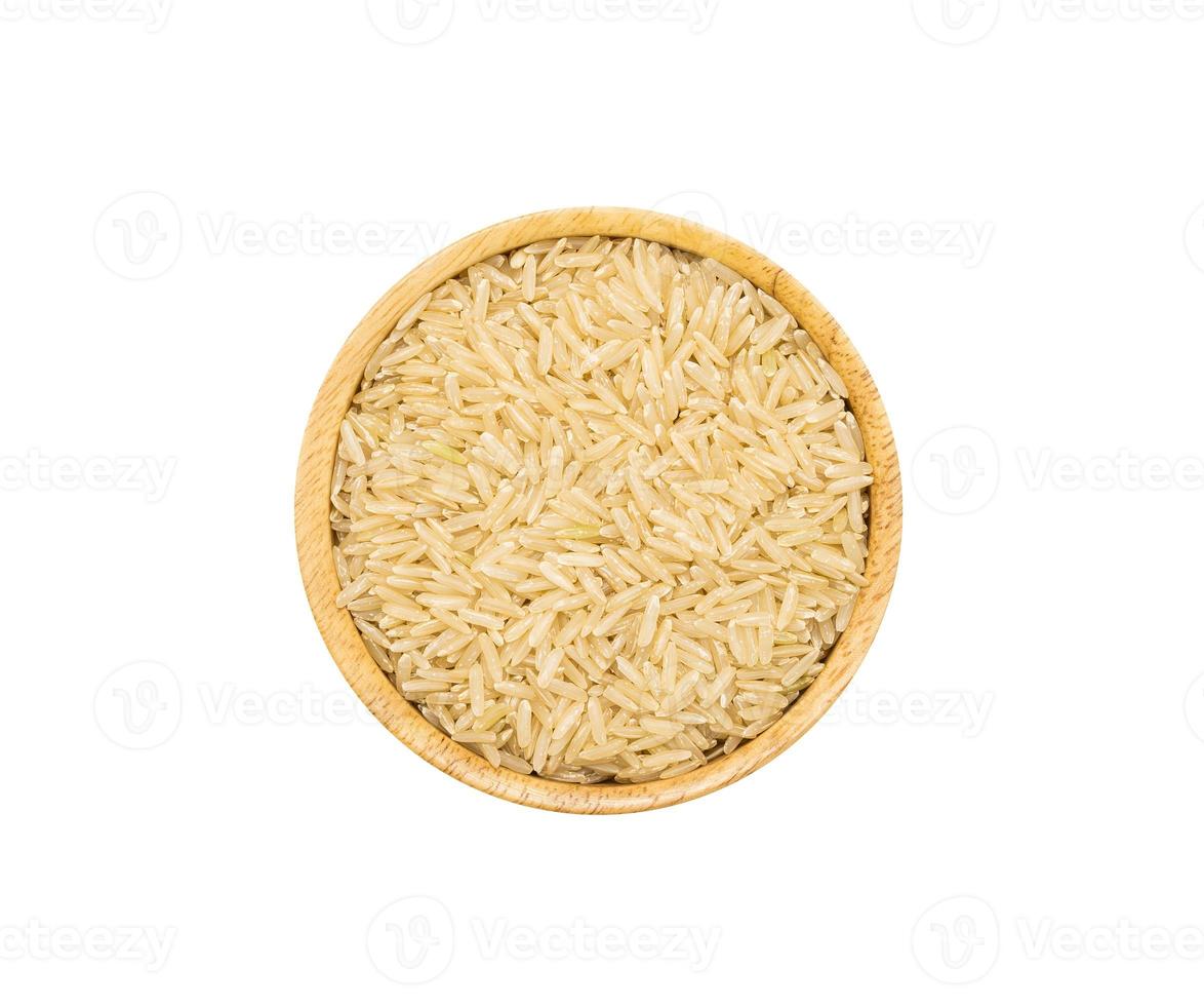 Uncooked dry Jasmine rice in wooden bowl on white background, top view photo