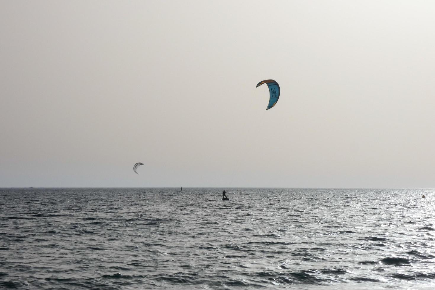 windsurfing, kitesurfing, water and wind sports powered by sails or kites photo