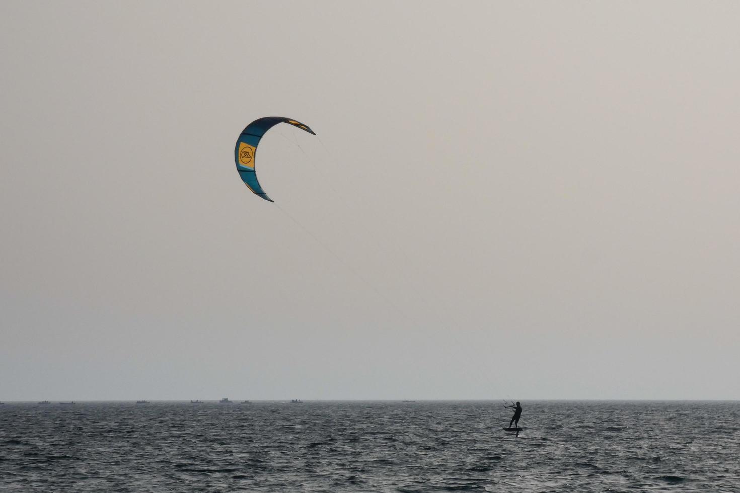 windsurfing, kitesurfing, water and wind sports powered by sails or kites photo