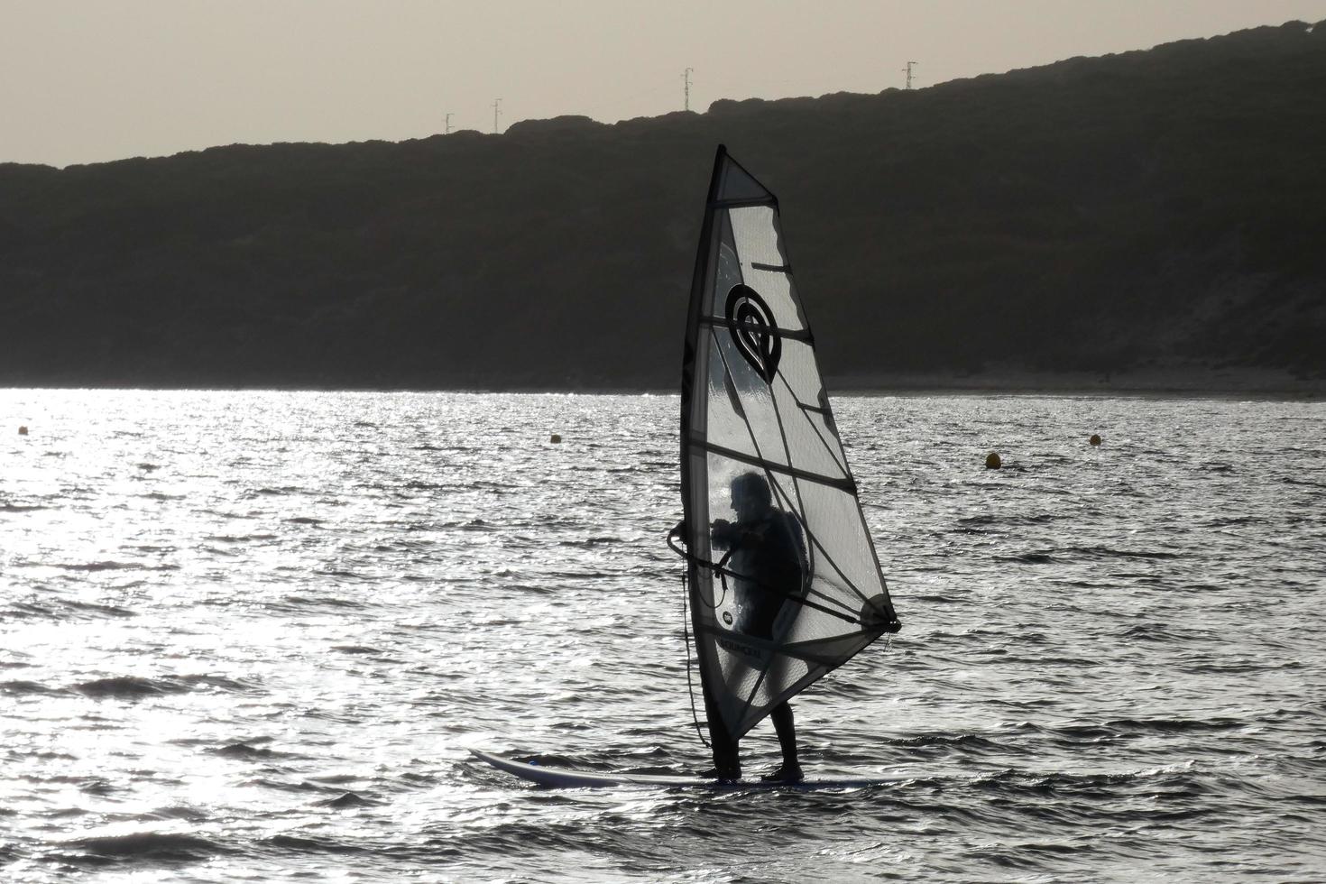 windsurfing, kitesurfing, water and wind sports powered by sails or kites photo