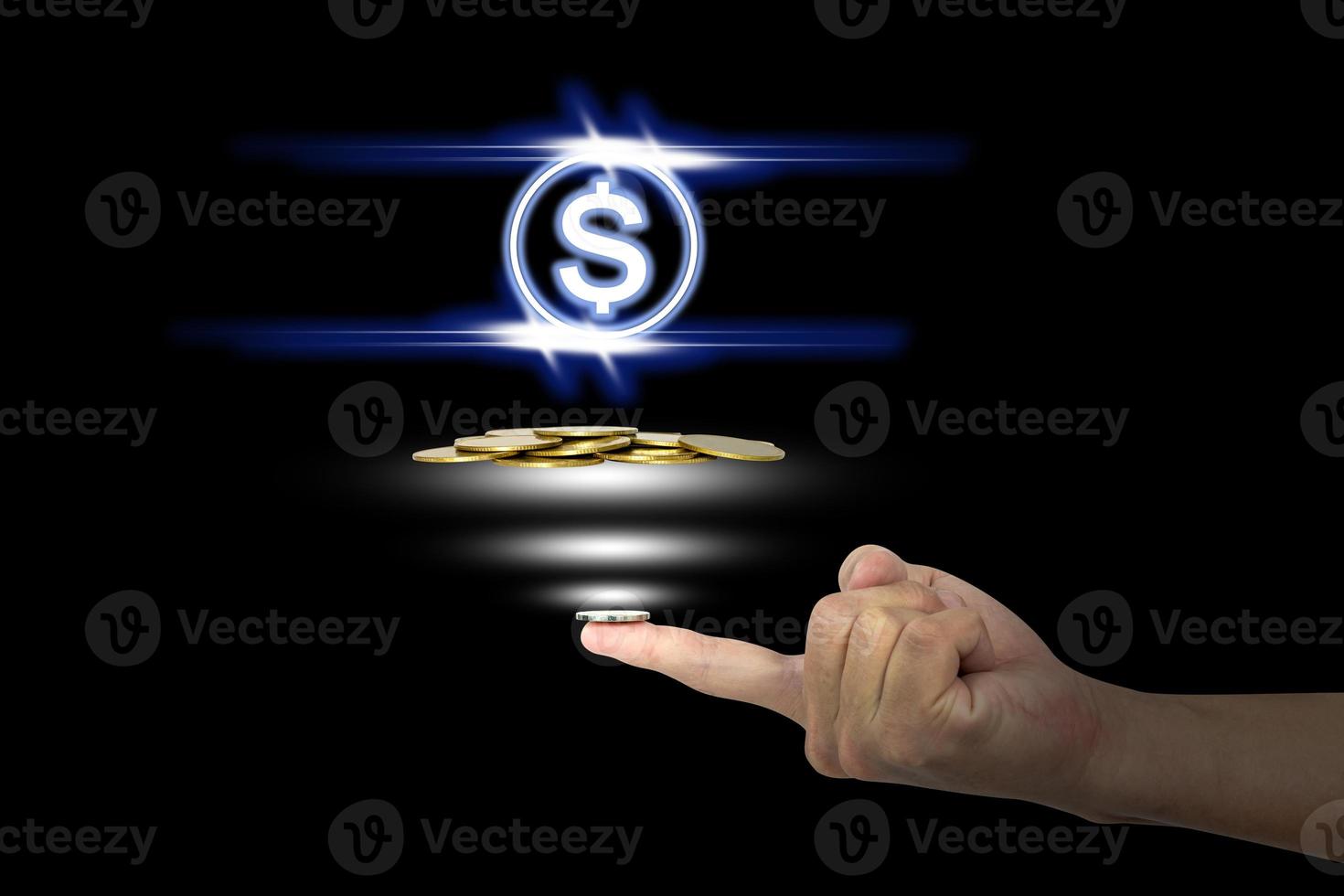 Coin on the finger with icon dollar photo