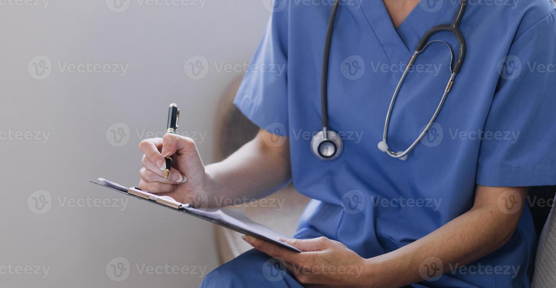 Homecare nursing service and elderly people cardiology healthcare. Close up of young hispanic female doctor nurse check mature caucasian man patient heartbeat using stethoscope during visit photo