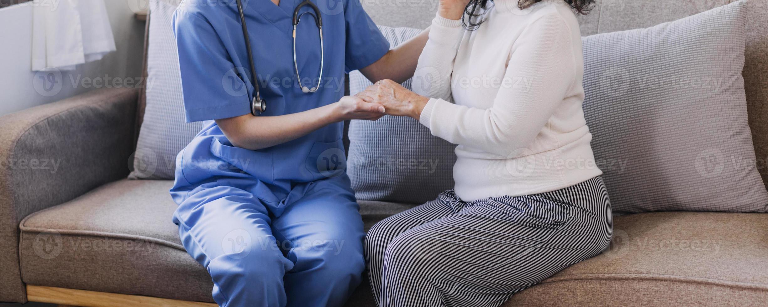 Homecare nursing service and elderly people cardiology healthcare. Close up of young hispanic female doctor nurse check mature caucasian man patient heartbeat using stethoscope during visit photo