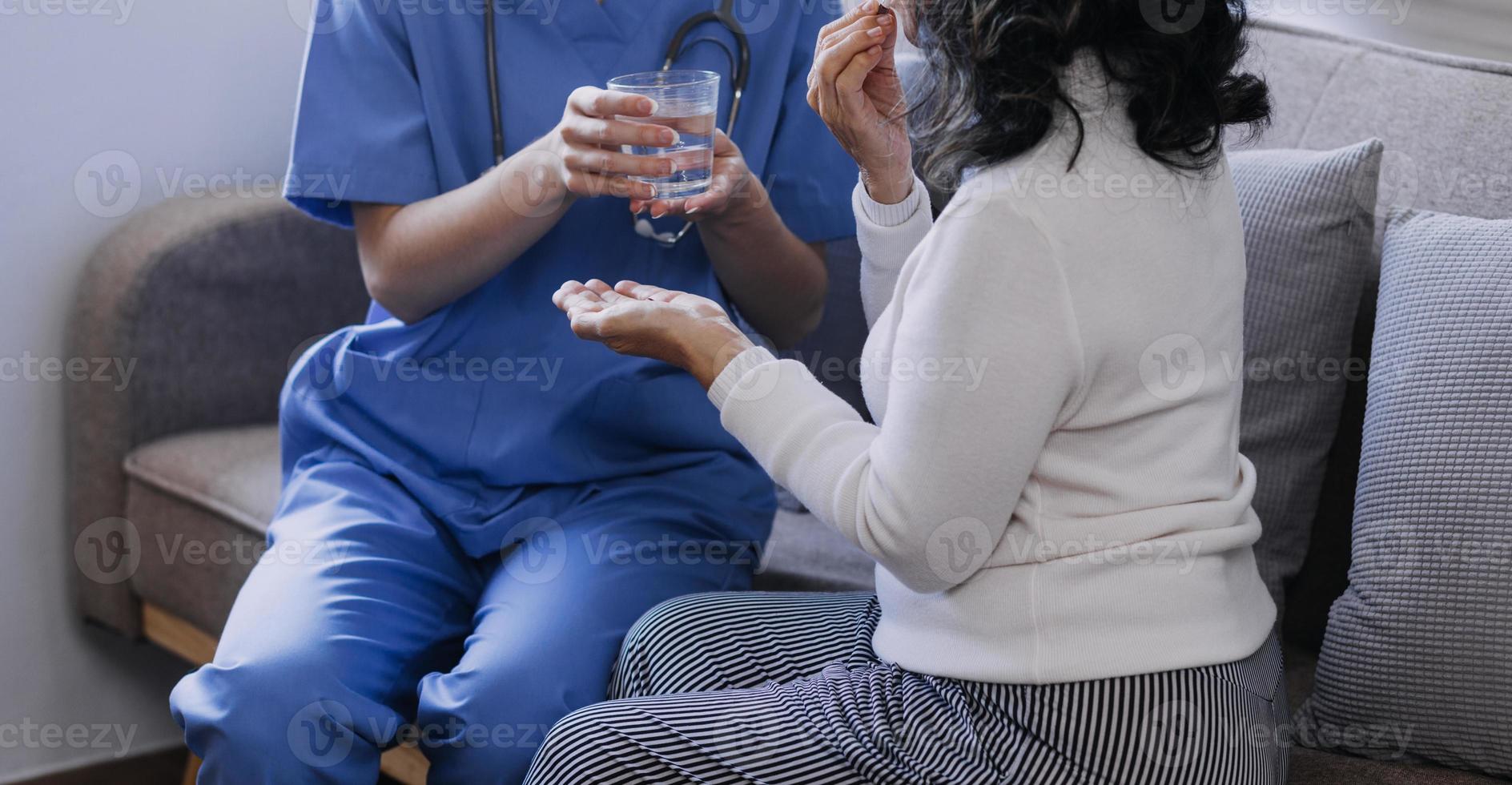 Homecare nursing service and elderly people cardiology healthcare. Close up of young hispanic female doctor nurse check mature caucasian man patient heartbeat using stethoscope during visit photo