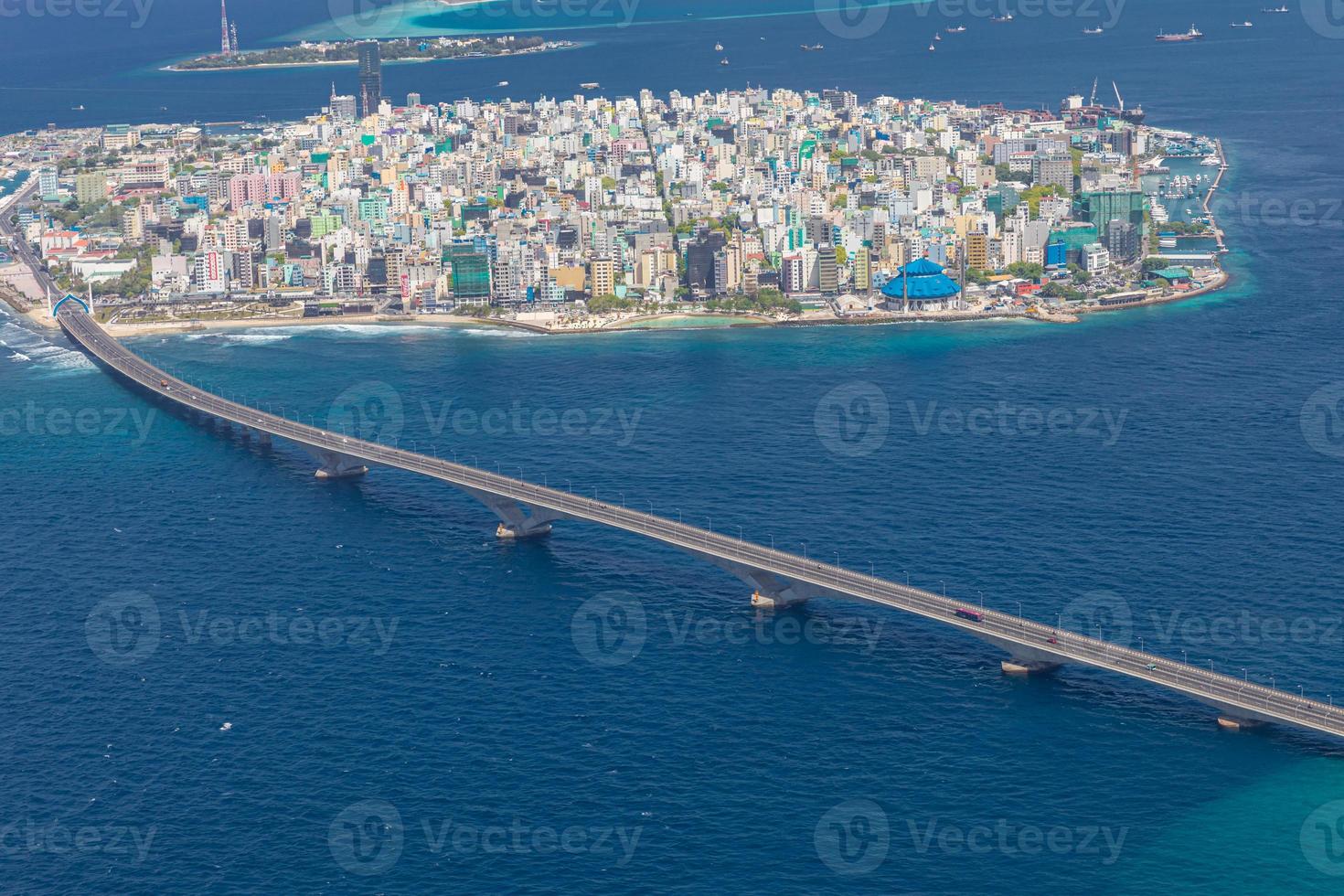 Maldivian capital from above, bridge towards the airport. Aerial view of atoll, cityscape. Travel landscape photo