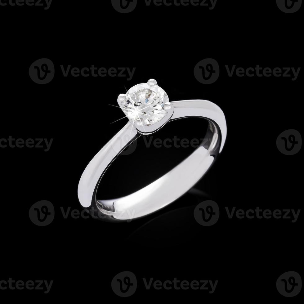 Engagement diamond ring on black background photo