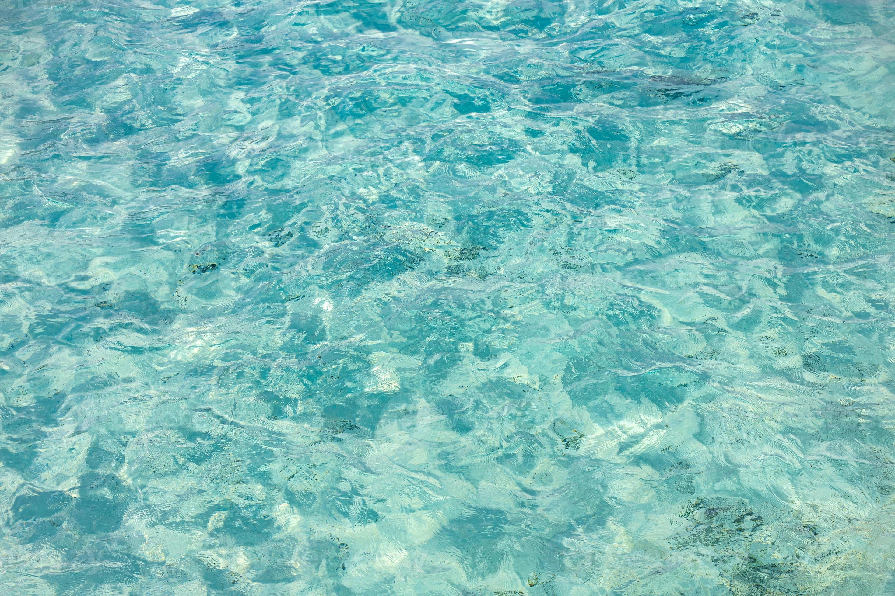 Natural blue water surface with bright sun light reflections, water in ...