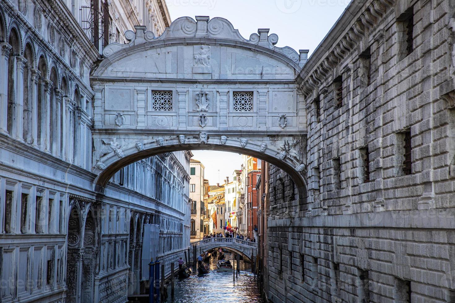 View of the famous Bridge of Sighs in Venice, Italy. Artistic urban landmark, soft sunset light photo