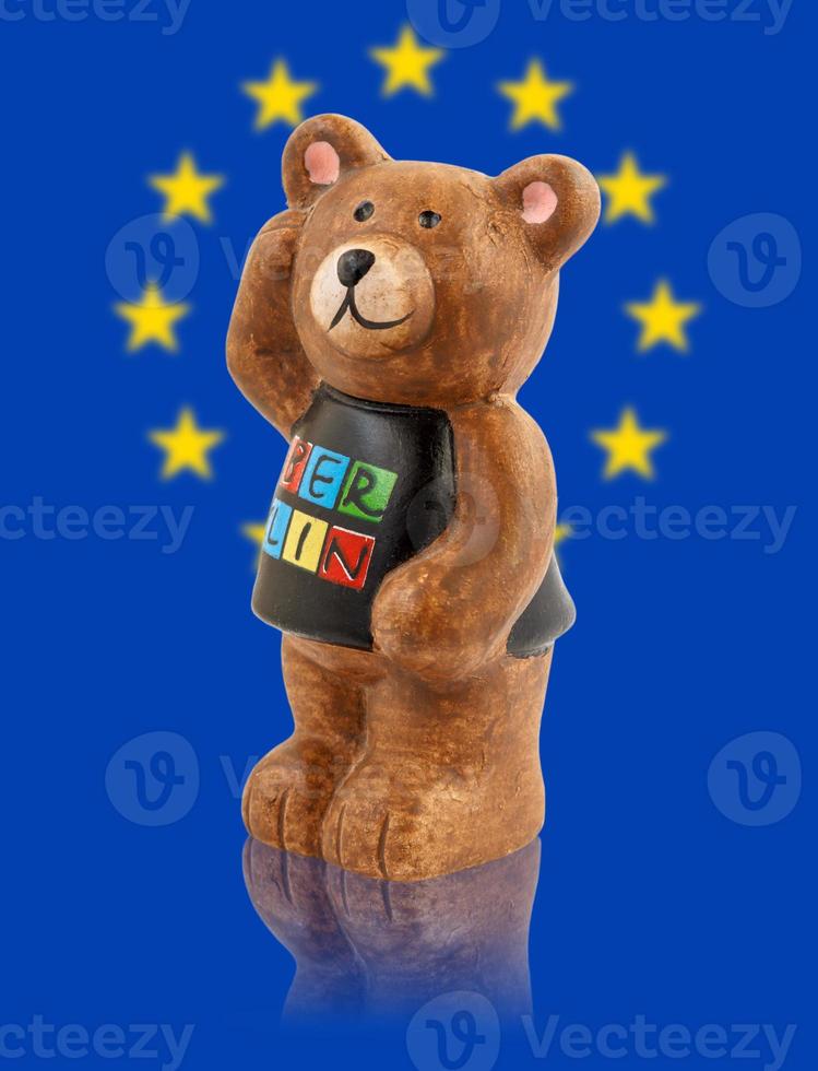 The bear is the symbol of the city of Berlin. Bear on the background of the flag of Europe. photo