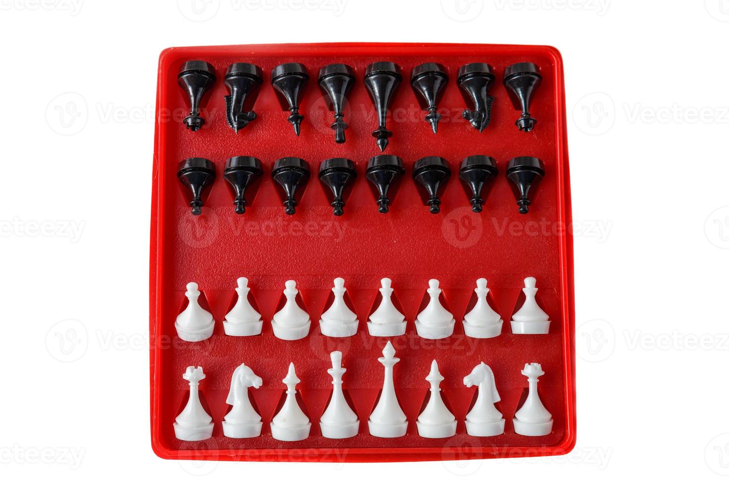 plastic chess board isolated on a white background. Travel chess. photo