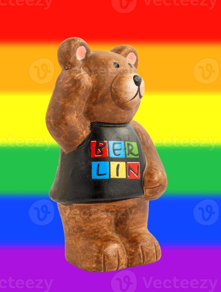 Bear symbol of Berlin. Bear on the background of the rainbow flag. photo