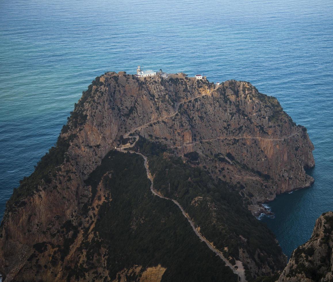A rocky island in the sea photo