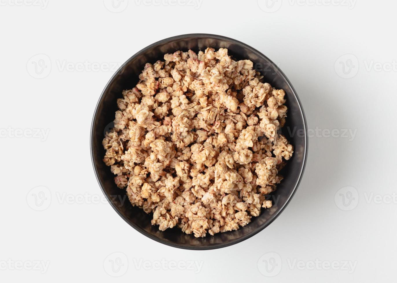 Granola in bowl on light background. photo