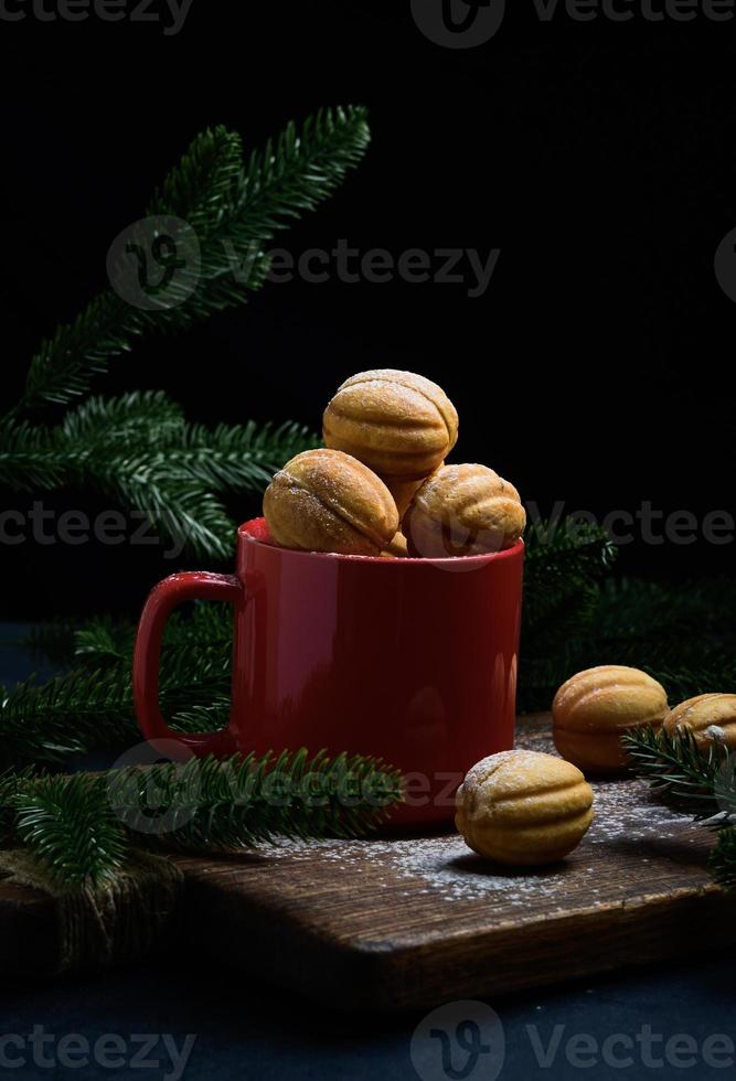 baked nut-shaped dessert in a red ceramic mug photo