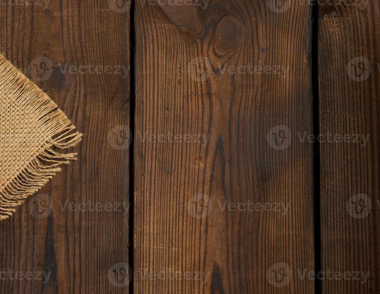 Background of brown wooden boards with cracks, scuffs. Backdrop for compositions, rustic photo