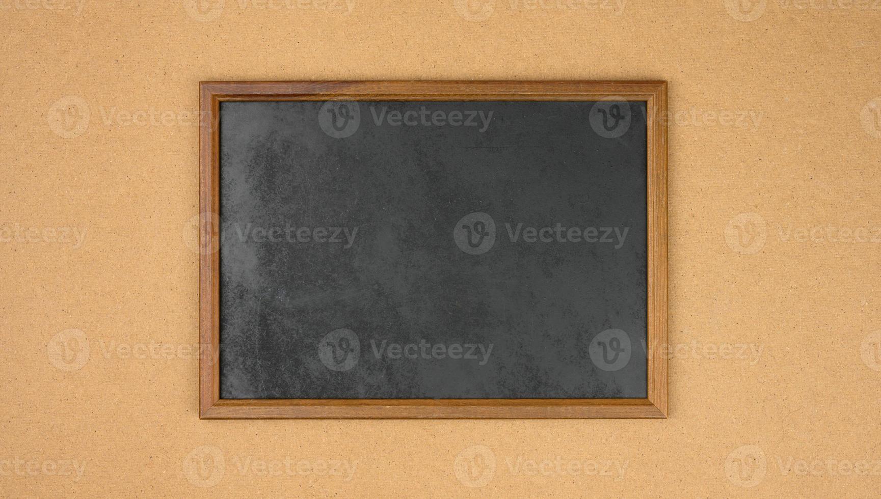 empty rectangular brown wooden frame on a brown background photo