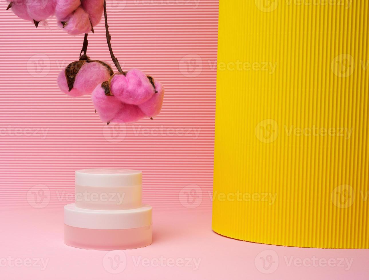 white jar for cosmetics on a pink background. Packaging for cream, gel, serum, advertising and product promotion, photo