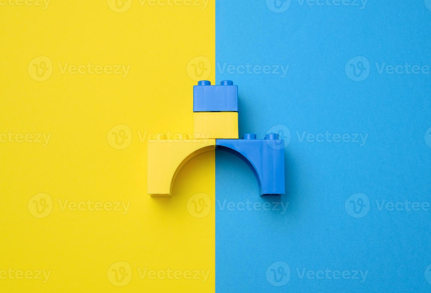 Plastic yellow-blue details of the children's designer. Children's educational game, top view photo