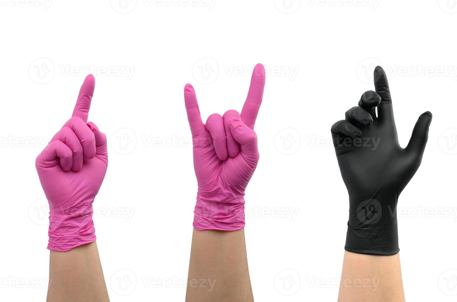 female hand in pink and black latex glove isolated on white background photo
