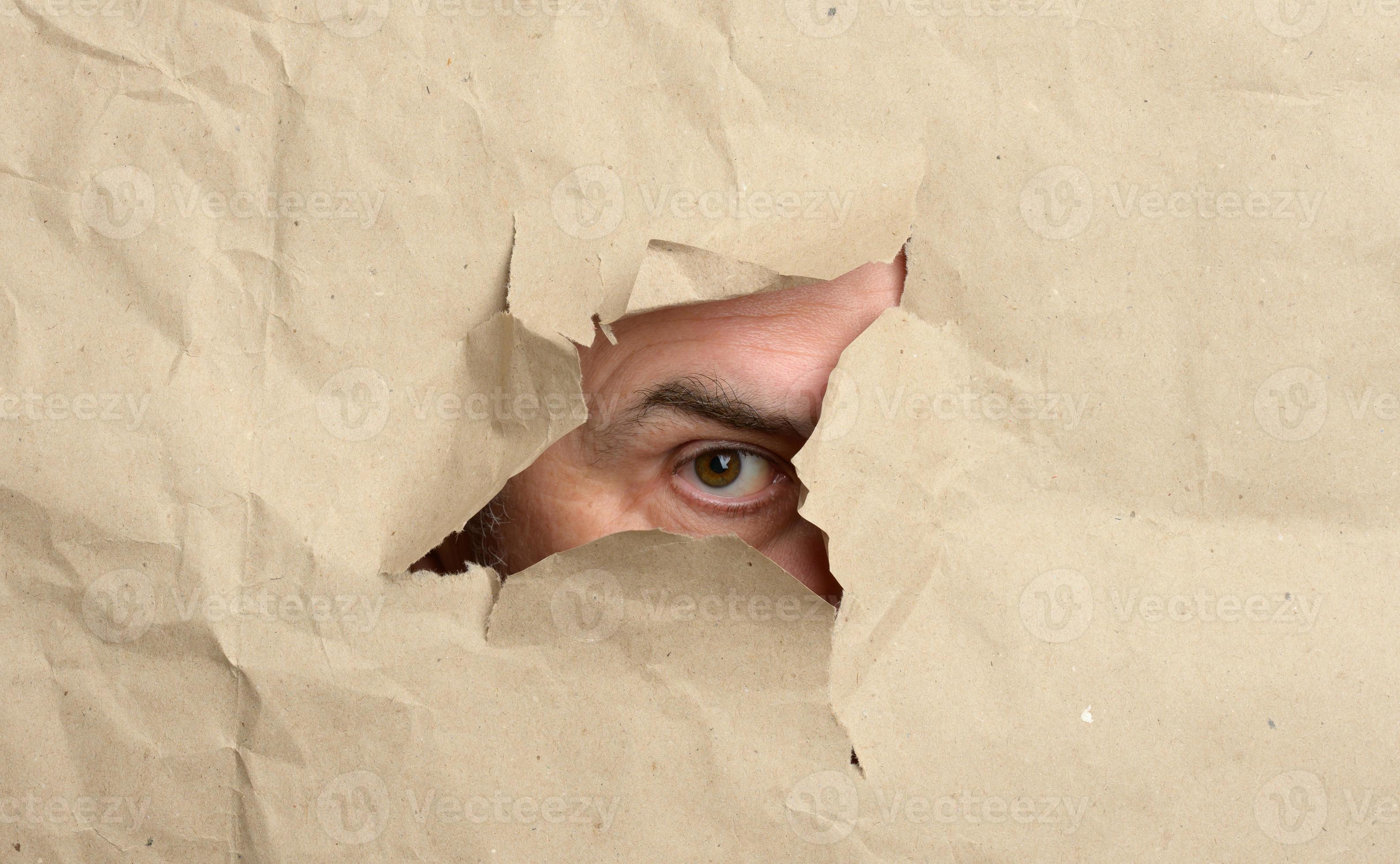 peeping torn hole in brown paper with male peeping eye, man spying and peeping  19032900 Stock Photo at Vecteezy