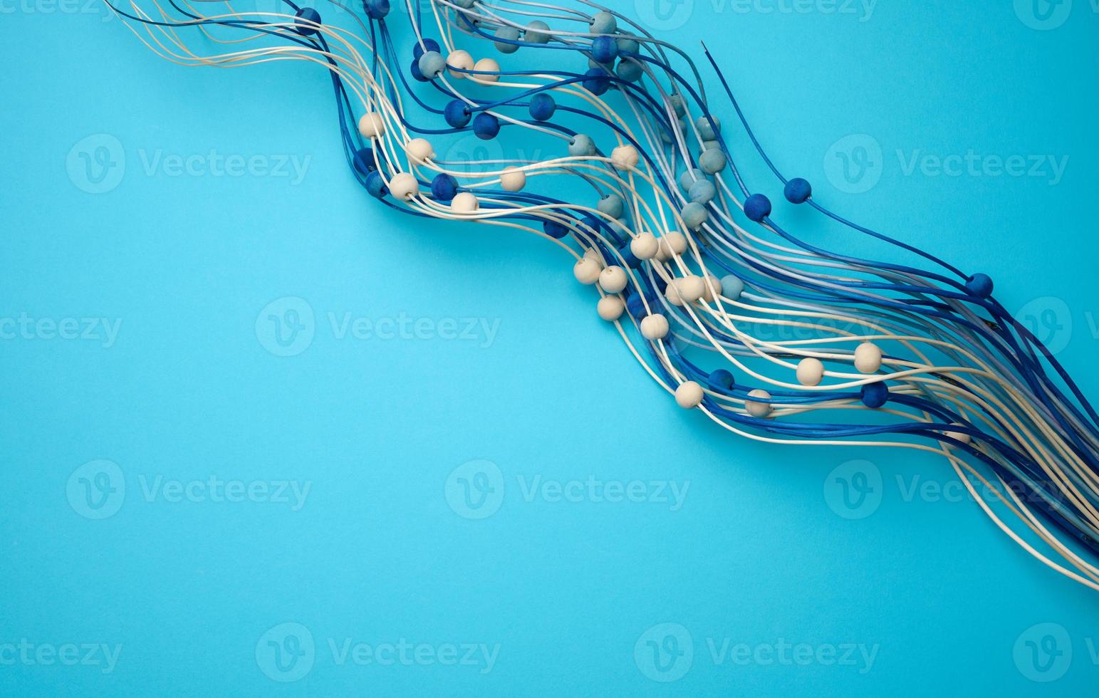 blue background with wooden blue decor branch. Backdrop for product demonstration, for writing photo