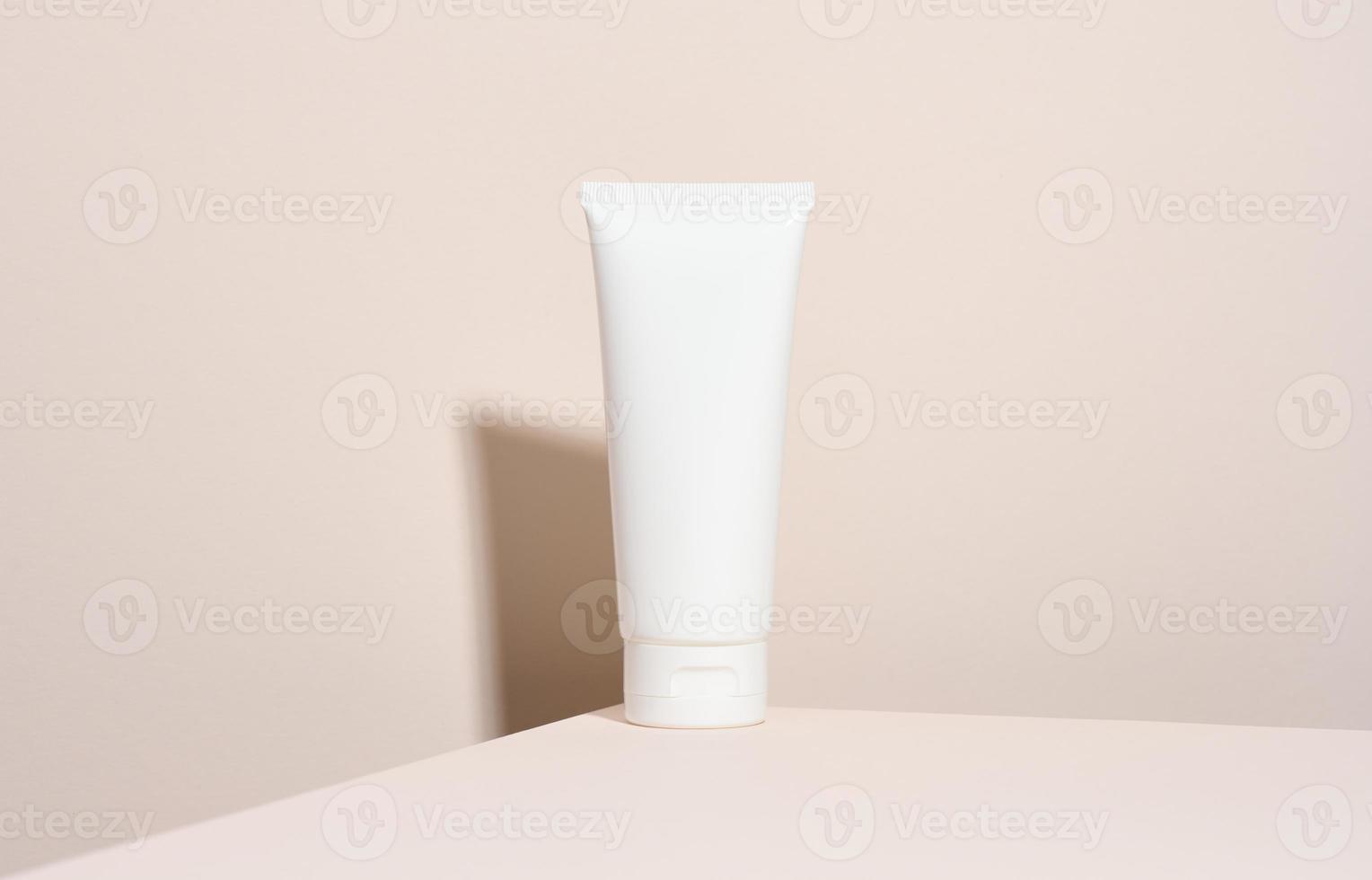 empty white plastic tubes for cosmetics. Packaging for cream, gel, serum, advertising and product promotion, mock up photo