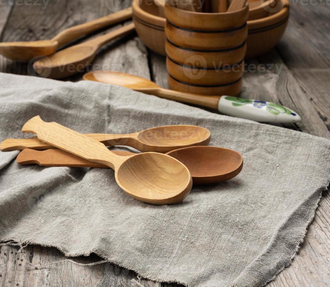 empty wooden spoons on a gray table photo