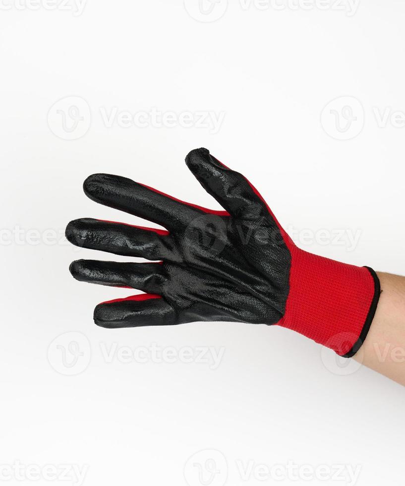 hand in a textile work glove in a gesture of holding something on a white background photo