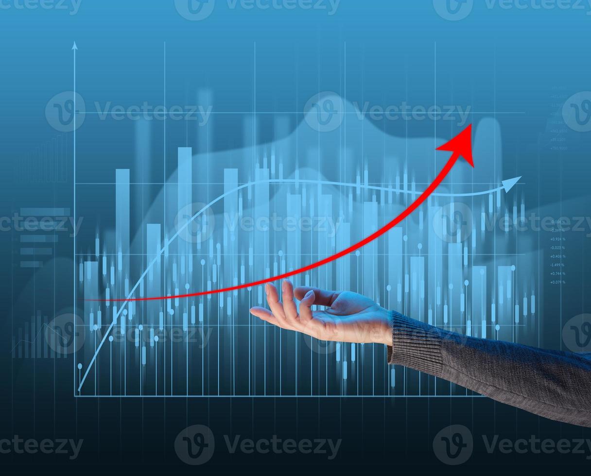 Holographic graph with growing indicators and a woman's hand. Business growth concept photo