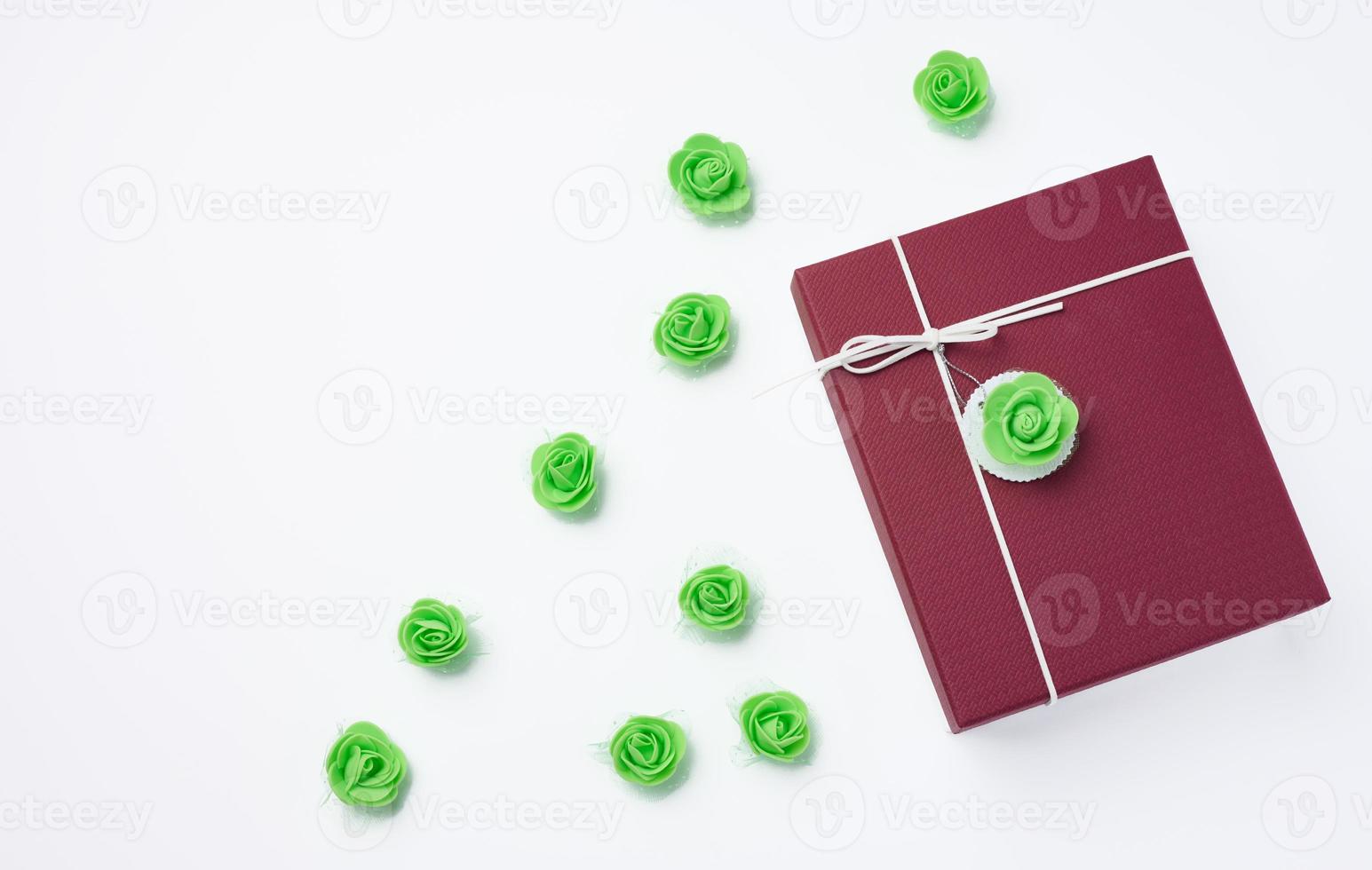 Red cardboard gift box with lid on white background photo