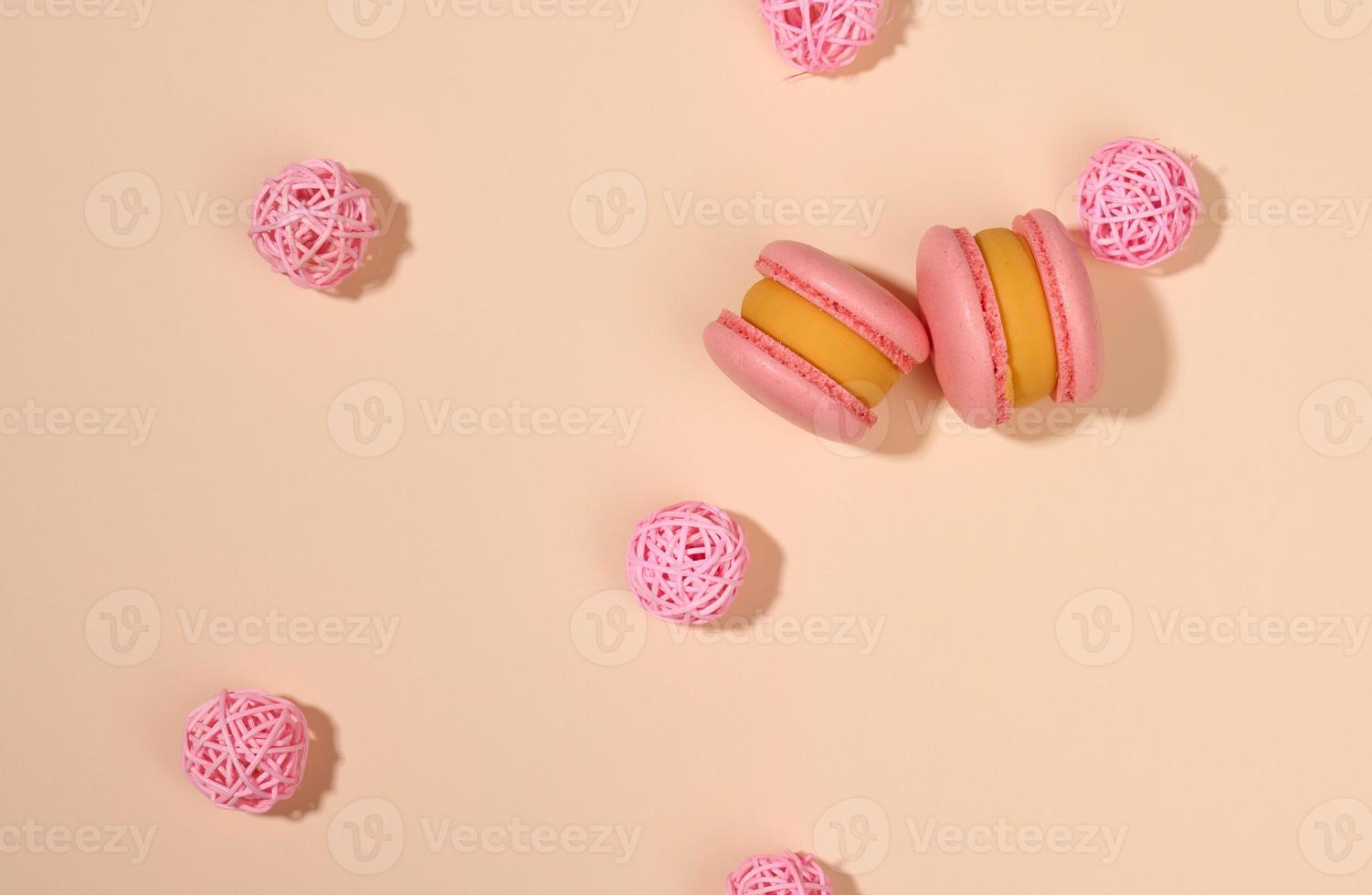 baked round macarons on a beige background, delicious dessert, top photo