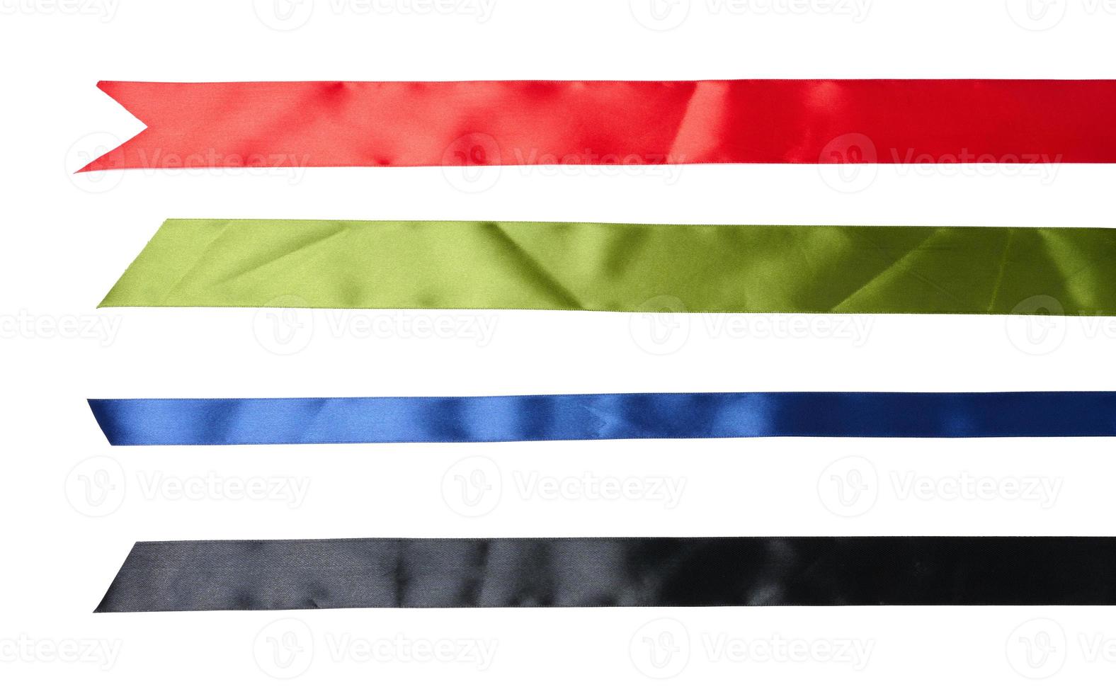 set of multicolored silk ribbons on abel background. View from above photo