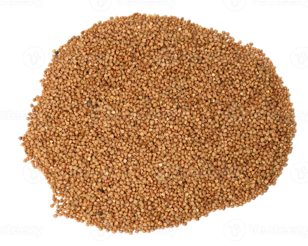 heap of uncooked buckwheat grains isolated on white background, top view photo