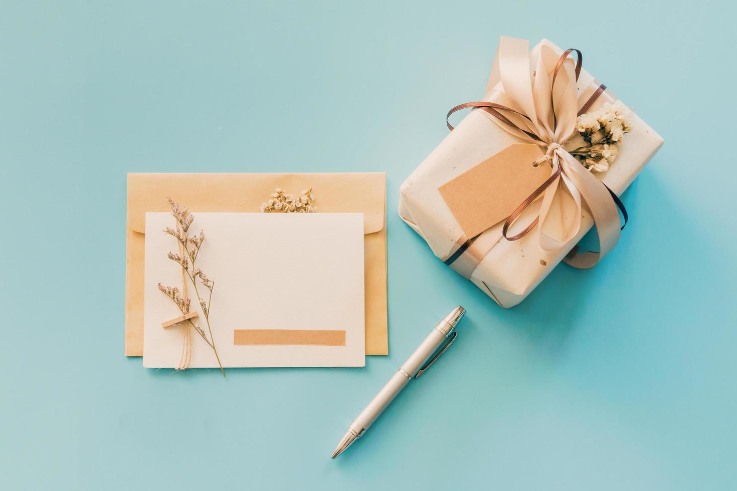 Greeting card and gift boxs on blue background, copy space for text photo