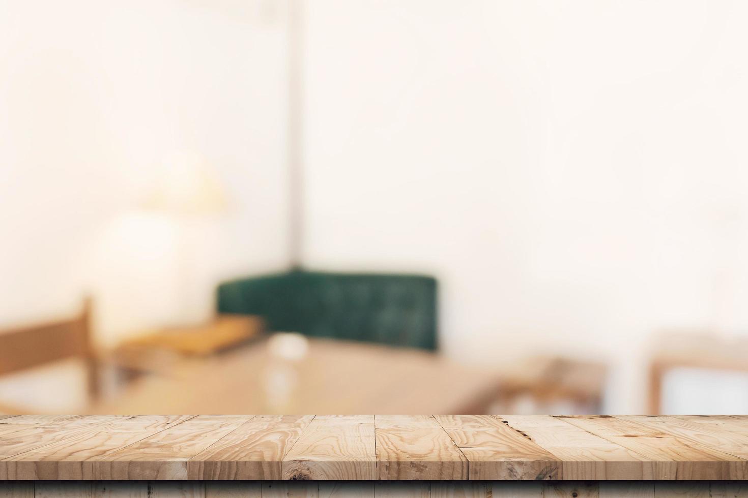 Wooden table top with blurred people in coffee shop and cafe background for display montage, copy space. photo