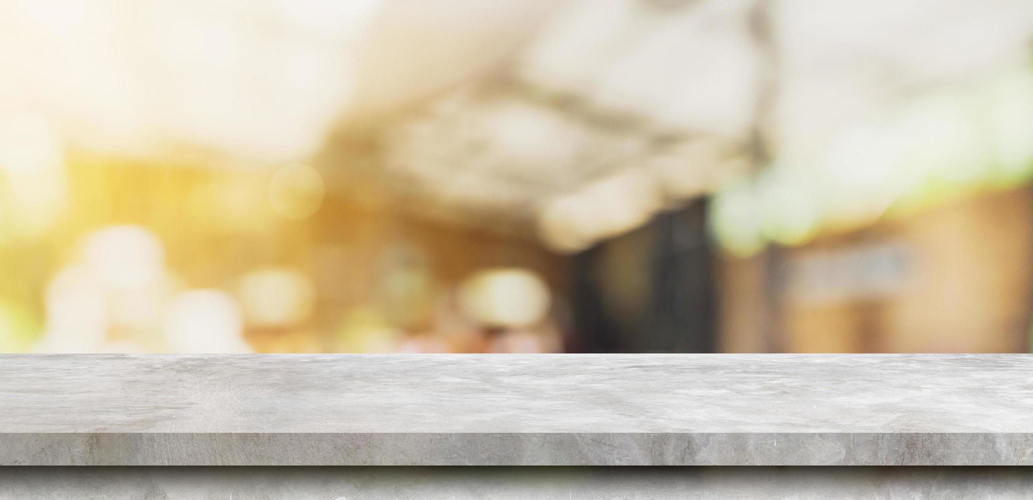 Empty concrete stone table top and Abstract blurred light table in coffee shop and cafe with bokeh background. product display template. photo