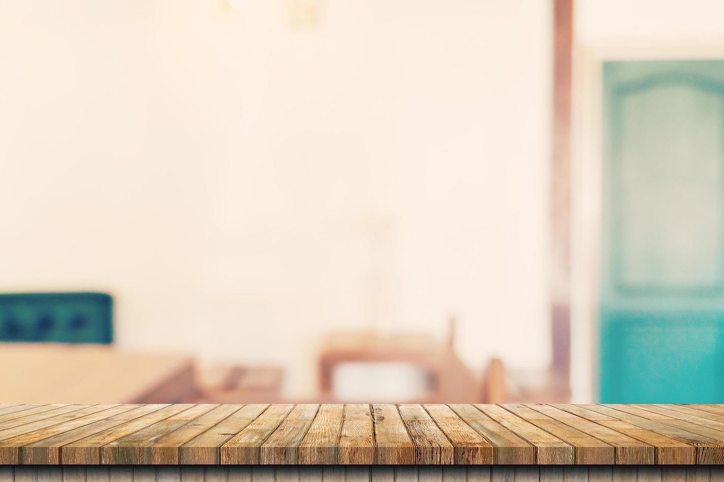 Wooden table top with blurred people in coffee shop and cafe background for display montage, copy space. photo