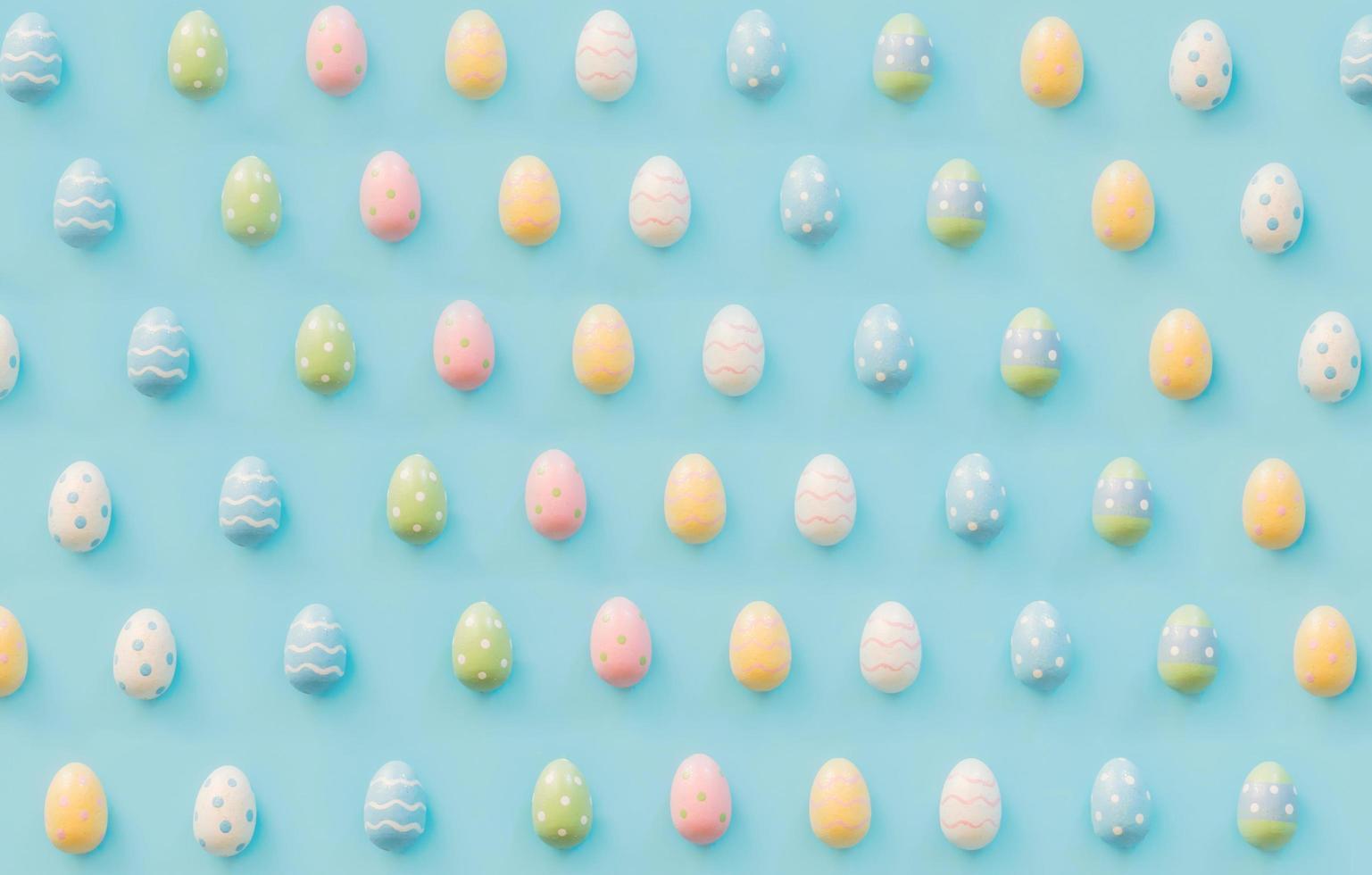 Easter eggs on blue background with copy space for text photo