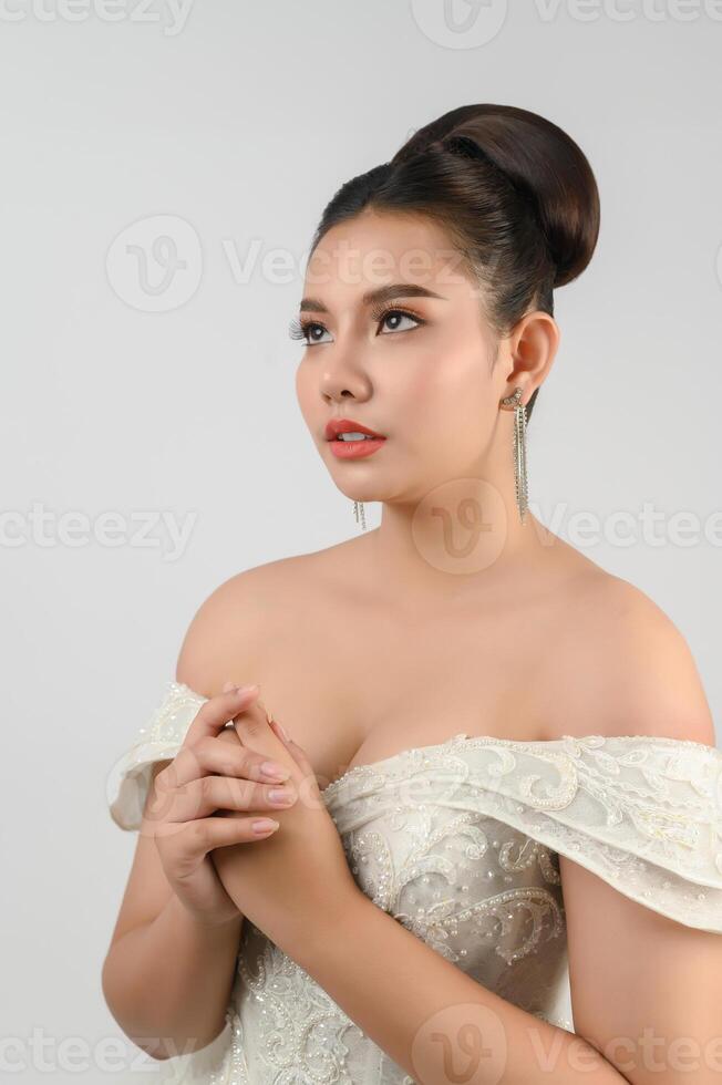 Young asian beautiful bride smile with happy on white background photo