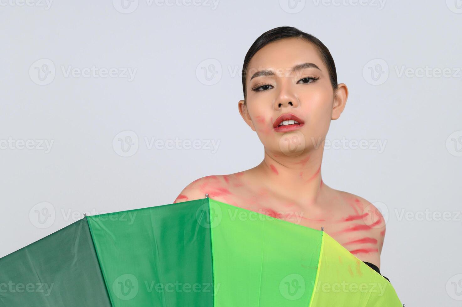 Pretty woman LGBQ pose with colorful umbrella photo