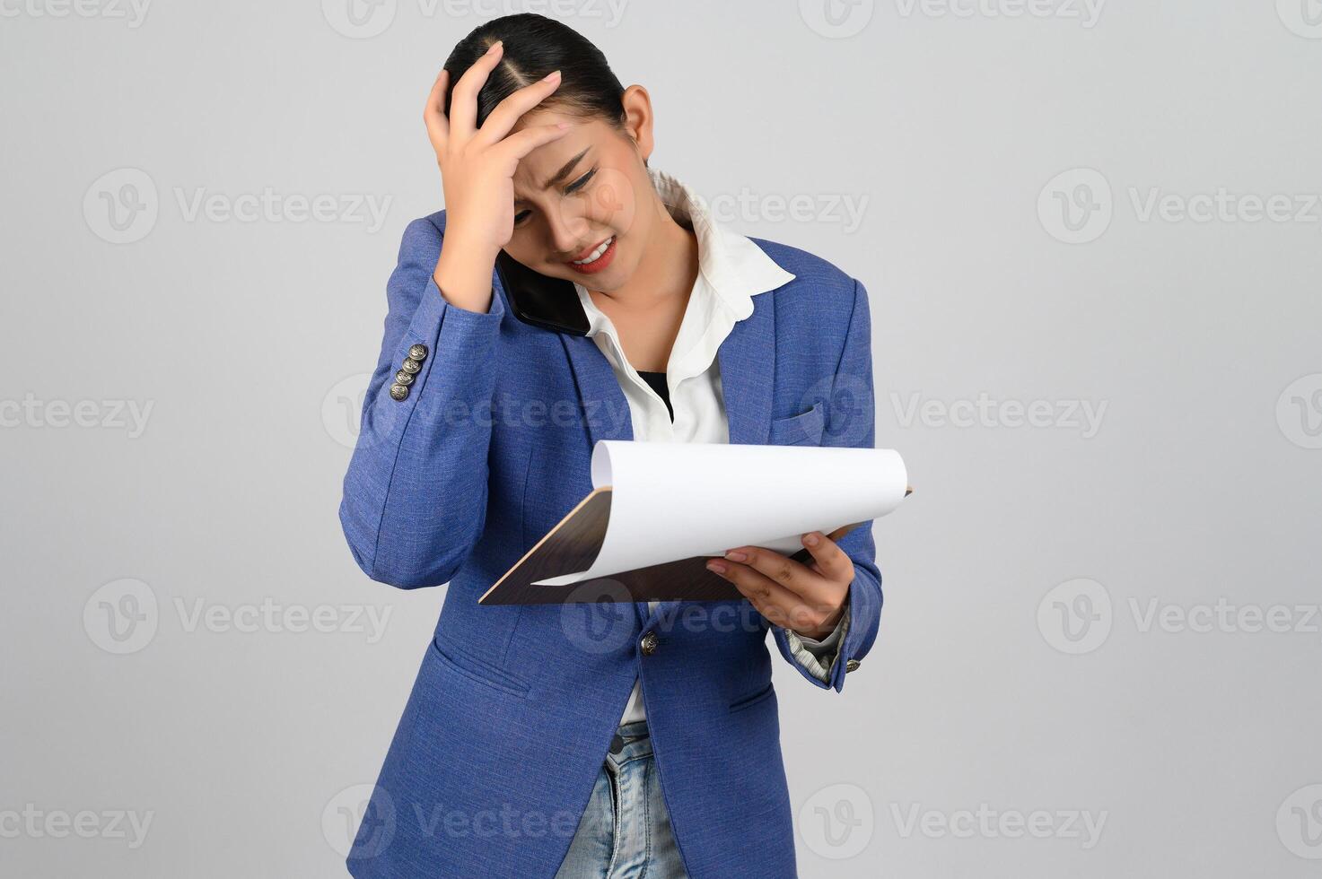 Young beautiful woman in formal clothing for officer with headache posture photo