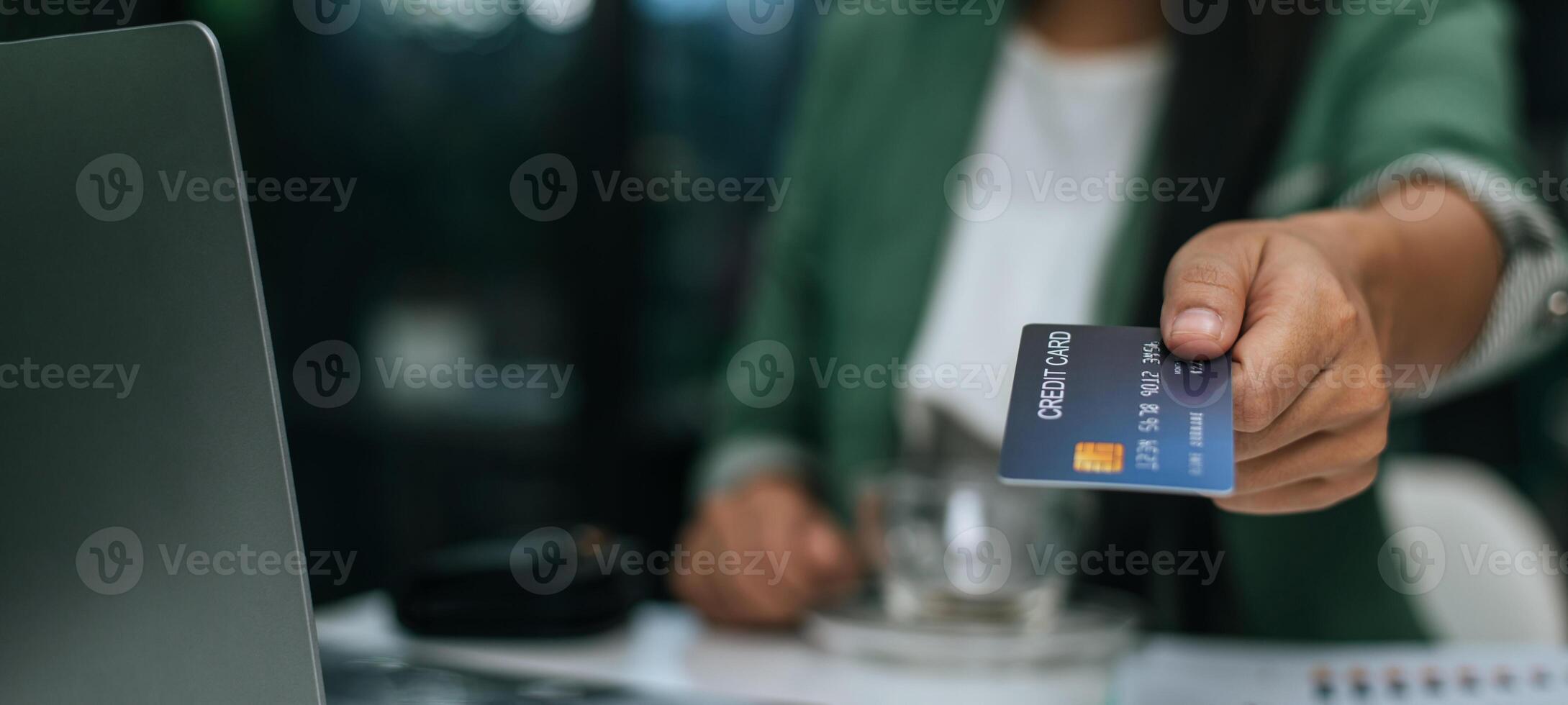 Young businesswoman paying order having contactless payment with cardit card photo