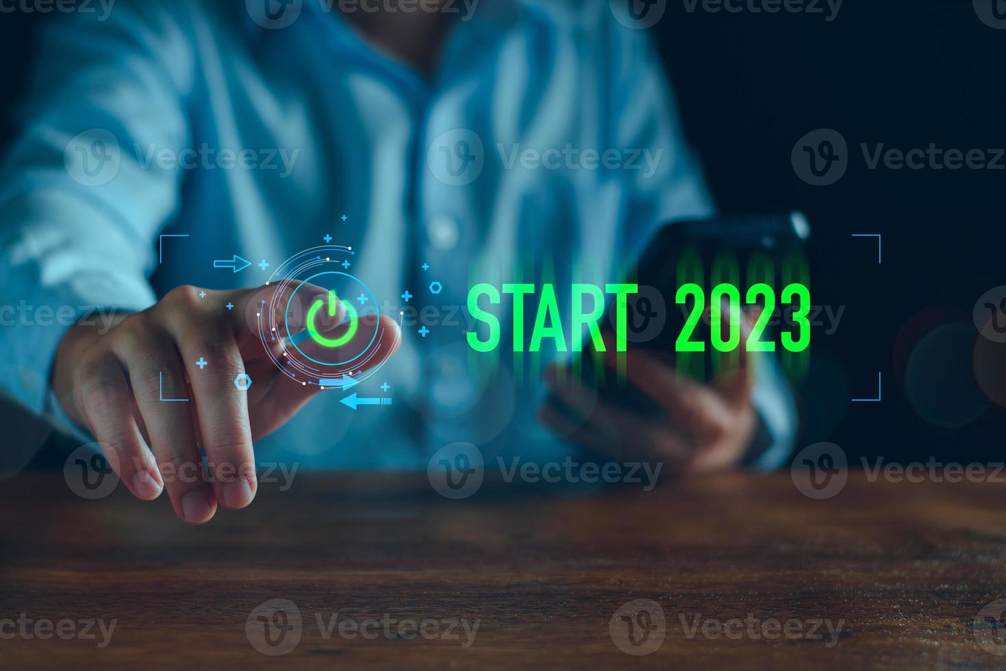 Businessman touching on virtual screen start button for 2023 New Year, Start new year 2023 with goal plan, goal concept, action plan, strategy, new year business vision. new start up business. photo