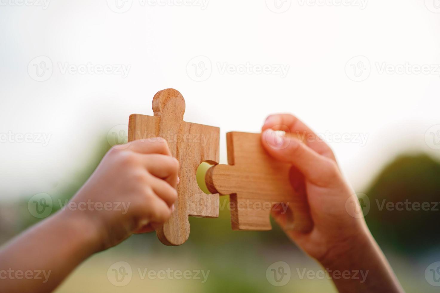 Team work concept, wooden puzzles put together. puzzle piece teamwork concept photo