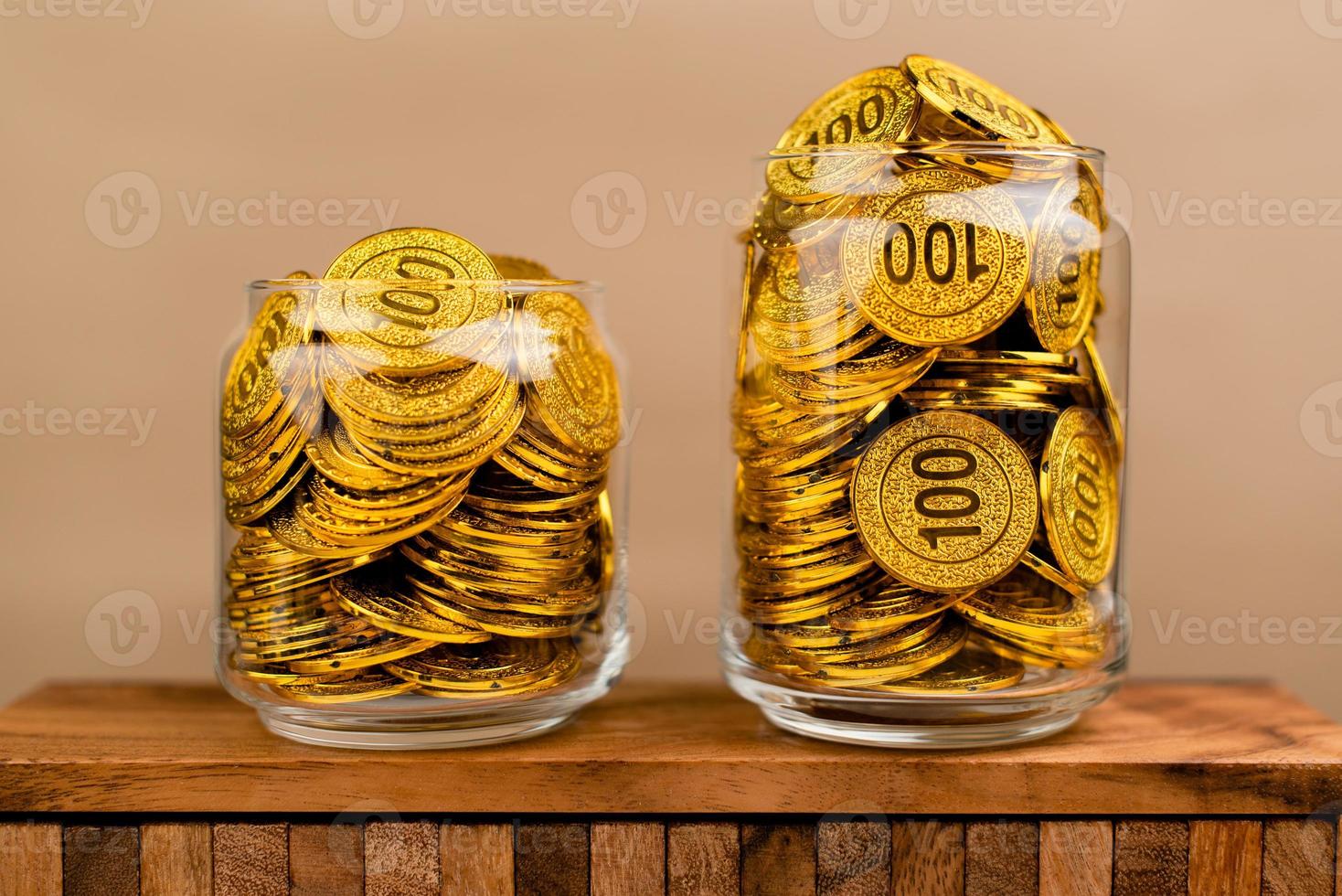 Saving gold. Saving money. Gold savings concept in a glass jar. Store gold in a glass jar. photo