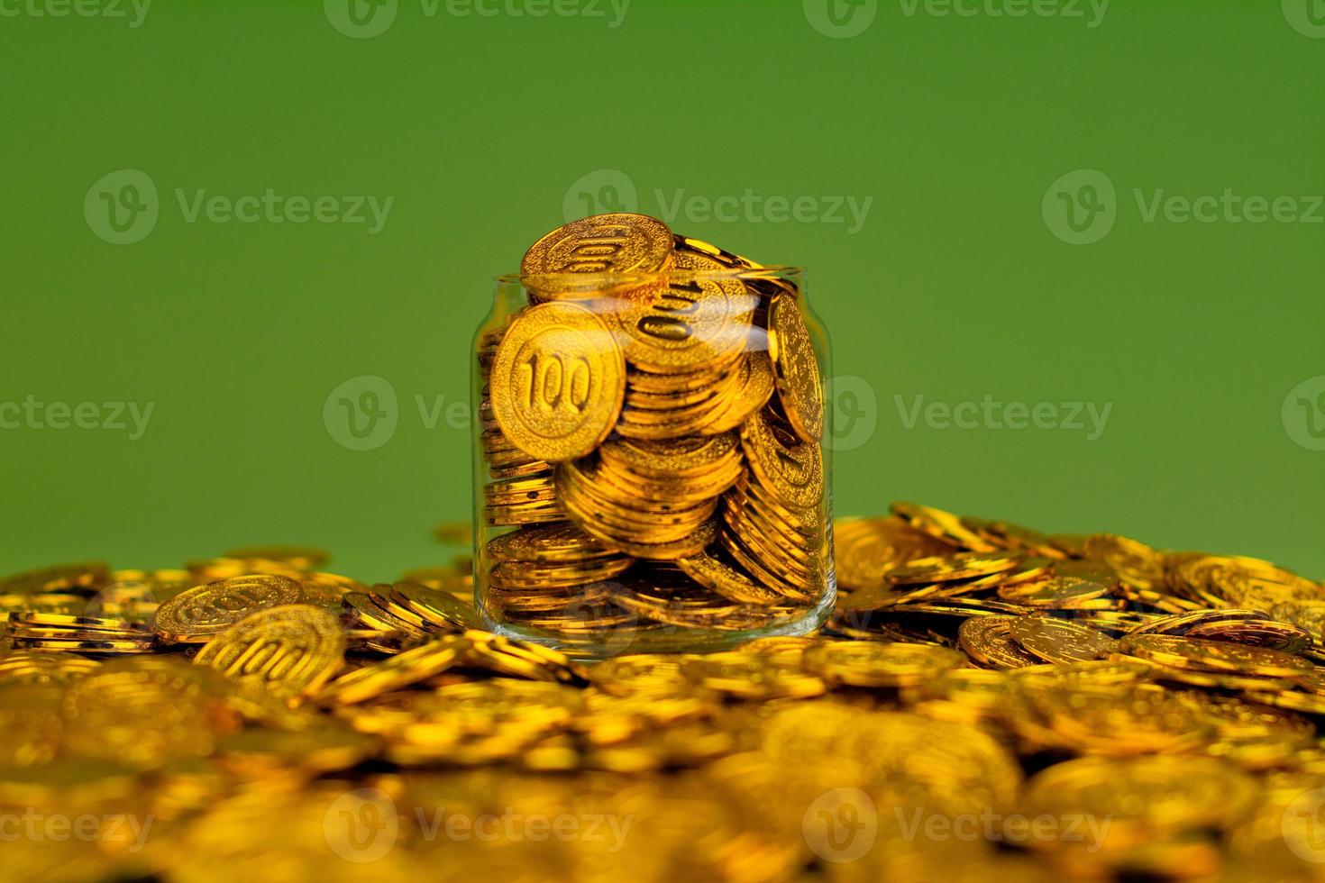 Saving gold. Saving money. Gold savings concept in a glass jar. Store gold in a glass jar. photo