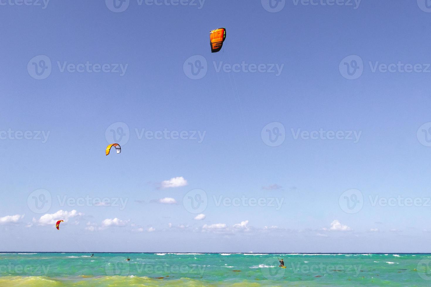 Water sport like kitesurfing kiteboarding wakeboarding Playa del Carmen Mexico. photo