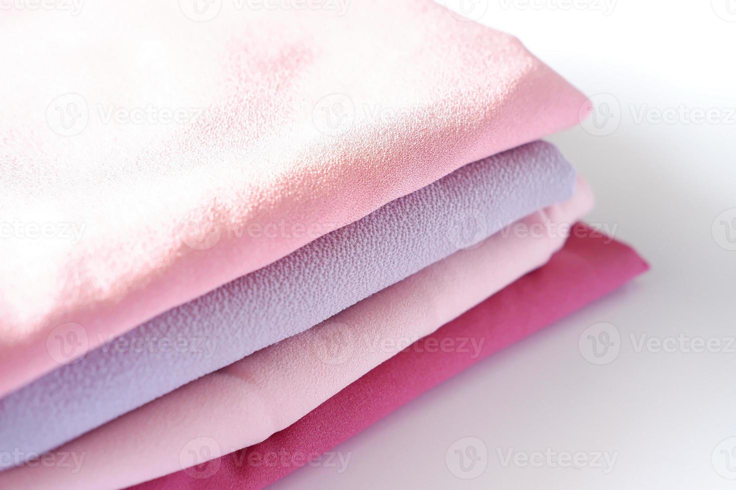 various beautiful and attractive fabrics folded neatly photo