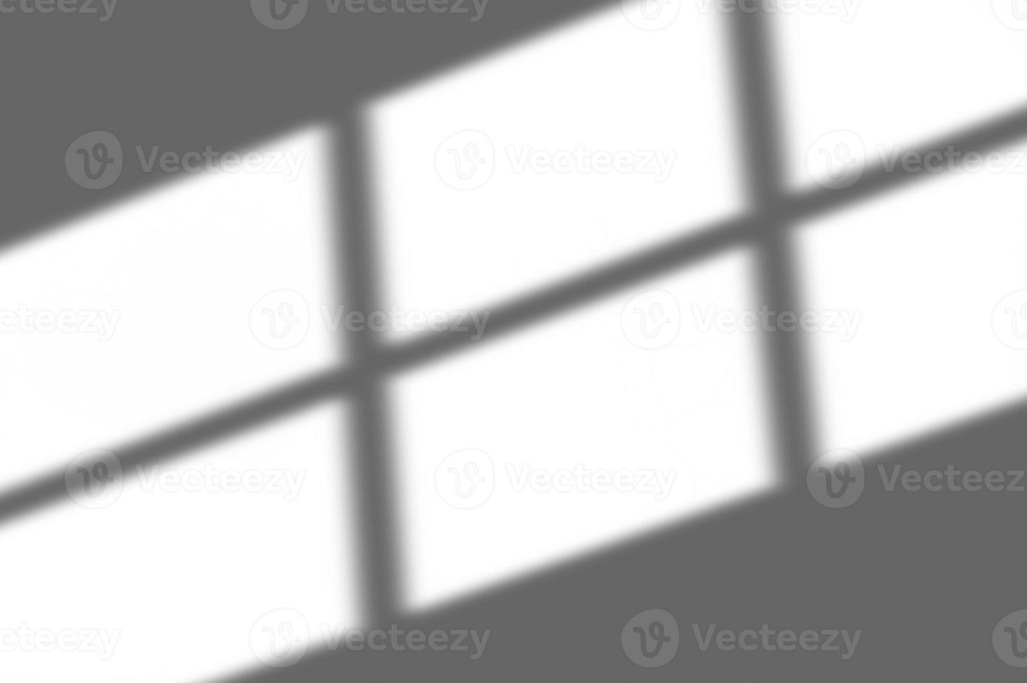 abstract shadow of the window in morning light on white wall texture blur background photo